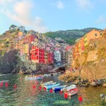 The pastel colored cliffside fishing village in the Cinque Terre Region of Liguria Italy. Madi Nelson
