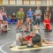 Greybull-Riverside Middle School wrestlers watch a demonstration by coach Tim Eardley and eighth-grader Haakon Craft during practice Monday evening in the Greybull High School wrestling room. Lisa Kunkel